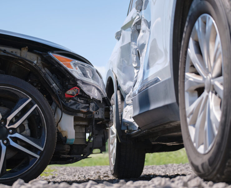 Damaged in heavy car accident vehicles after collision on city street crash site. Road safety and insurance concept Damaged in heavy car accident vehicles after collision on city street crash site. Road safety and insurance concept.